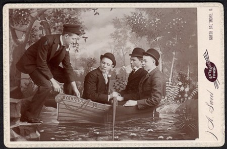 Four men boarding a boat cab