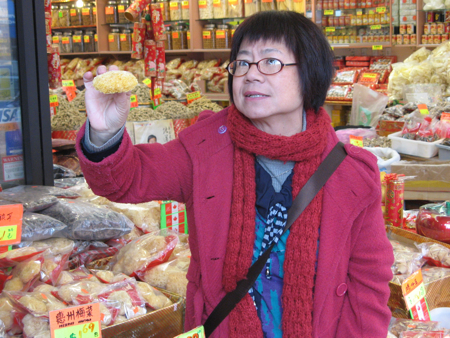 Stephanie Yuen explains about fungus in a Vancouver Chinatown herbalist shop