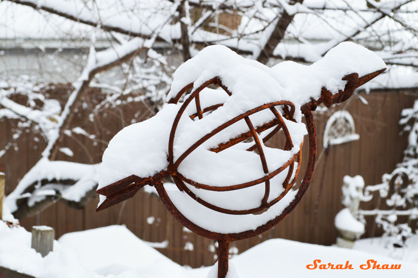 Trellis with armillary in the snow
