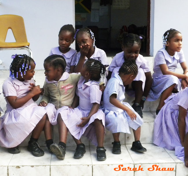 School girls gather outside their Johns Hall classroom in Jamaica