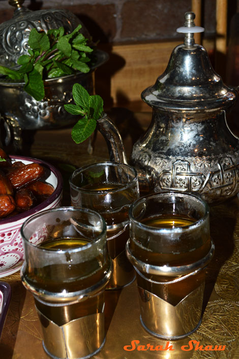 A vintage Moroccan sugar pot holds mint here for the tea party