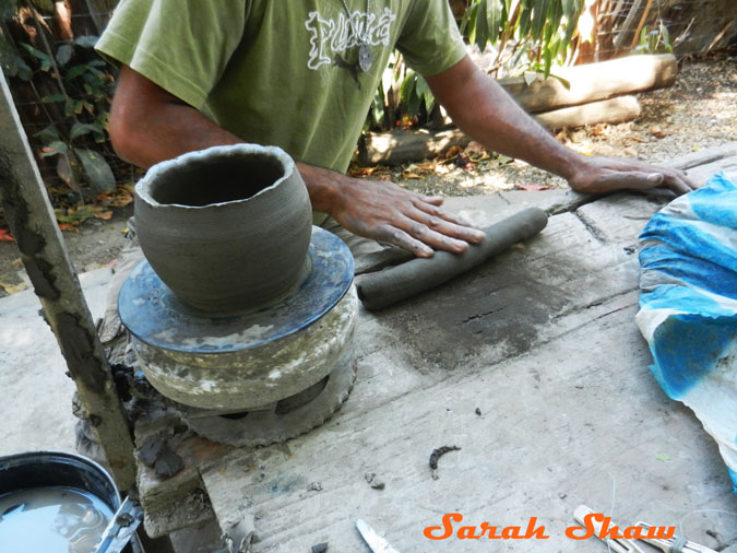 Rolling a coil of clay to add to a pot in Guatil, Costa Rica