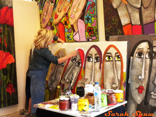An artist works in her booth at the Bastille Art Fair, Paris, France