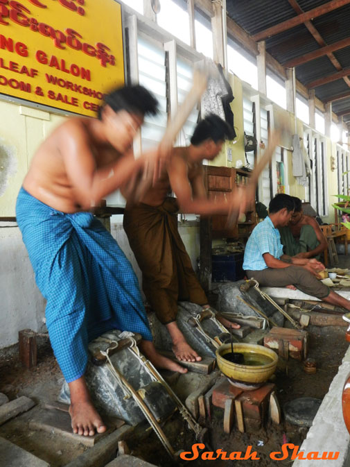 Synchronized hammering for gold leaf in Mandalay, Myanmar