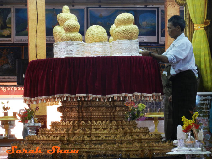 Five Buddhas loaded with gold leaf at a temple in Inle Lake, Myanmar
