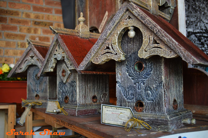 Architectural birdhouses from old barn wood at the Antique and Garden Fair hosted by the Chicago Botanic Garden