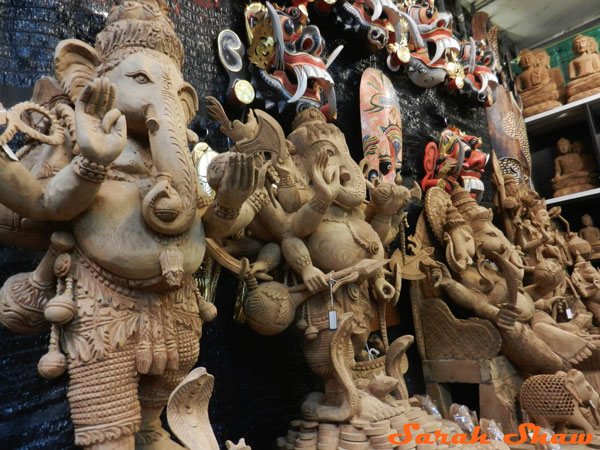 A row of wood Ganesh in the Chatuchak Weekend Market in Bangkok, Thailand