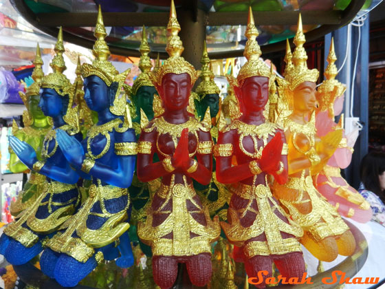 Brightly colored glass Thai figures for sale at Chatuchak Weekend Market