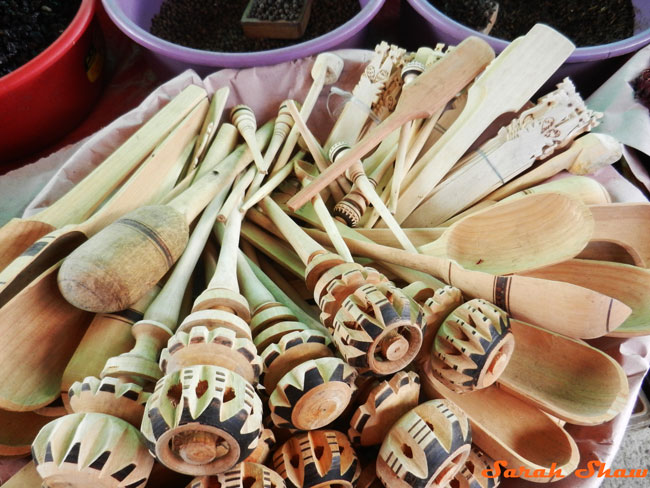 Wooden utensils, inlcuding molinillo, for sale at a local market in Oaxaca, Mexico