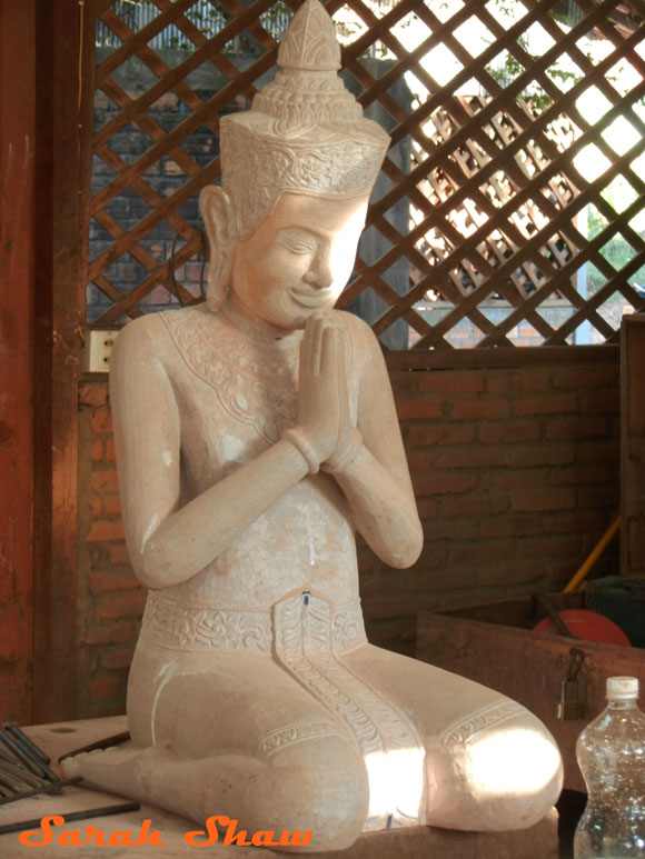 Wood carved figure from Artisans Angkor