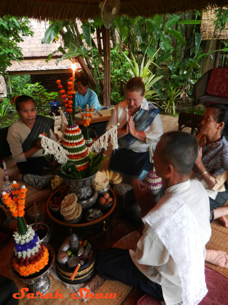 Recitations of mantras and blessings are part of a baci ceremony