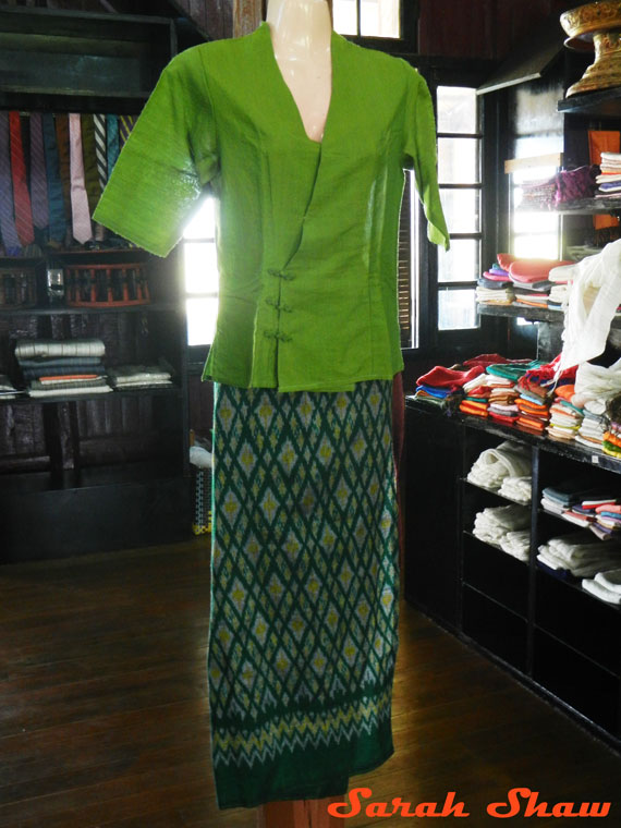 An ikat longyi is paired with a silk shirt and ready for a stylish woman in Myanmar