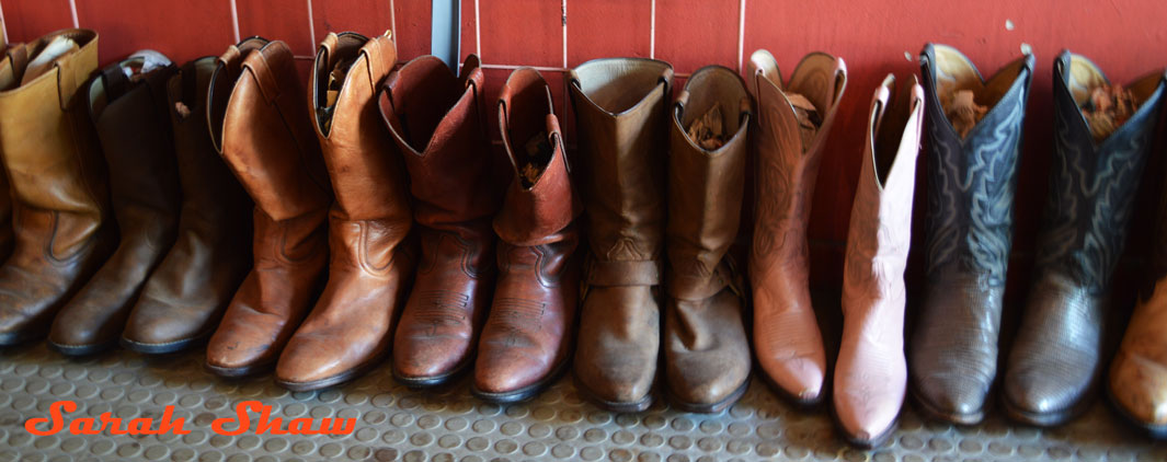 A row of cowboy boots offered at Courage My Love in Toronoto