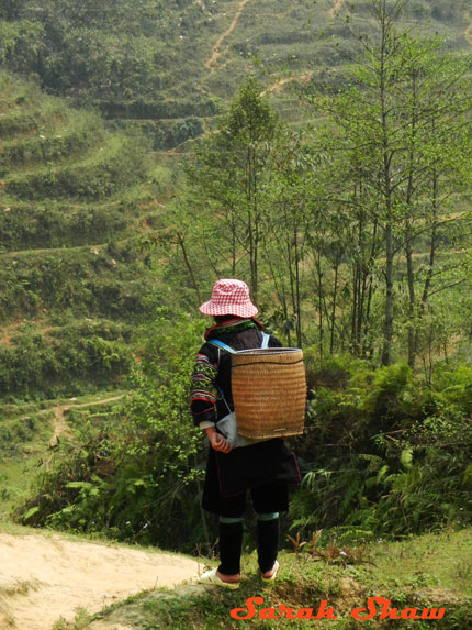 A Black Hmong woman hikes 