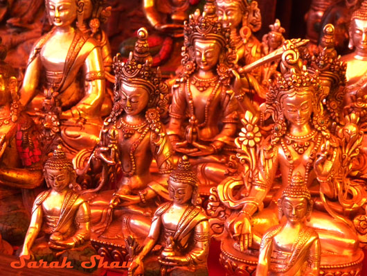 Statues of the Buddha and Tara are for sale in a Tsechu Market in Bumthang, Bhutan