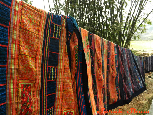 Hmong quilts line a path in Sapa, Vietnam