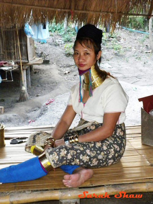 Padaung woman rings neck legs near Chiang Rai Thailand