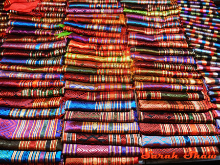 Silk scarves in brillant colors in the Night Market in Luang Prabang, Laos