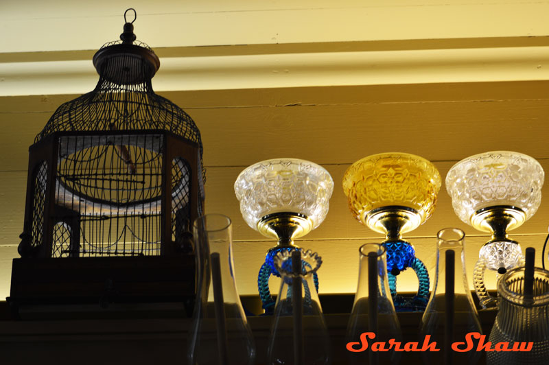 Birdcage with kerosene lamps