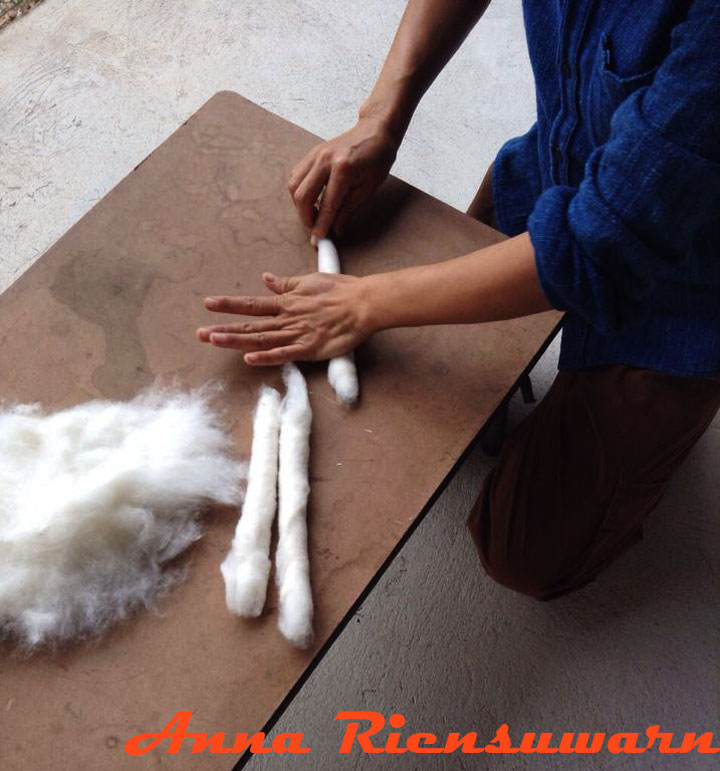 Preparing cotton for spinning in Thailand
