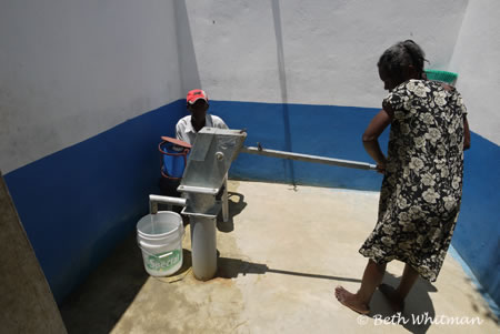 Woman at water Well in Haiti