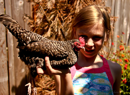 A girl and her hen