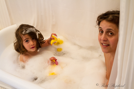 Mama and daughter in the tub