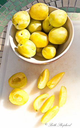 Greengage plums cut