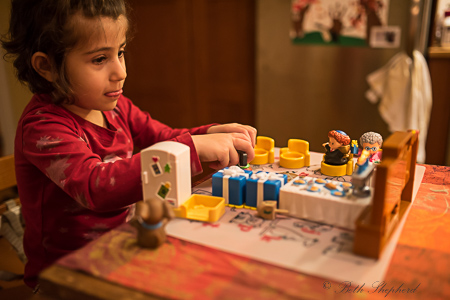 Playing with her Little People Hanukkah set