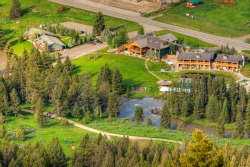 Aerial view of Rainbow Ranch in Big Sky, Montana by Kene Sperry