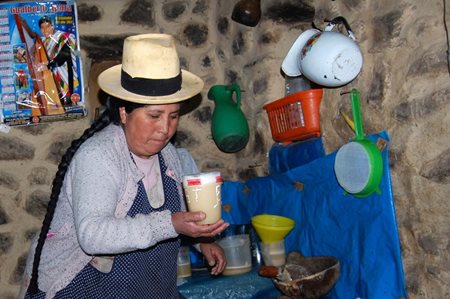 Peruvian Woman making chicha morada in Ollantaytambo