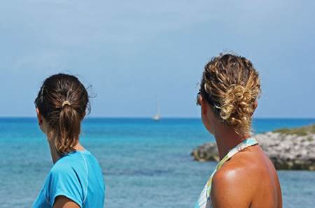 Jessica and Stephanie watching boat come in Flamingo Cay