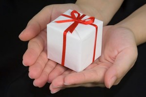 hands presenting gift