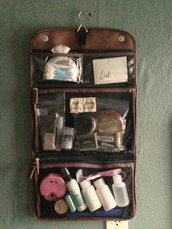 Packed travel toiletry kit hanging