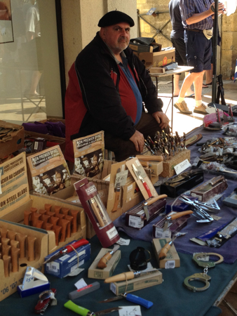 Man with handcuffs, Saturday Market, Sarlat, France