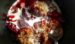 Cooked steel-cut oatmeal cobbler with cream. 