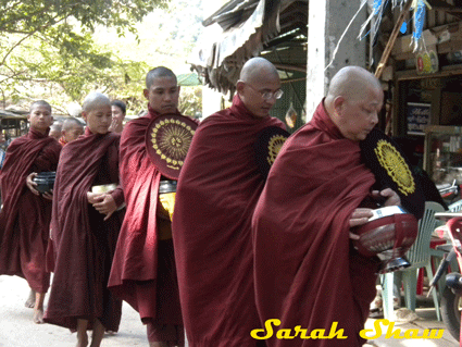 Monks on Morning Alms Round in a Village in Burma