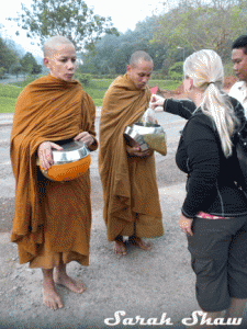 Alms offered to Monks at Sunrise near Chiang Rai, Thailand