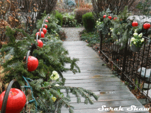 Apples and pine garlands line a walkway
