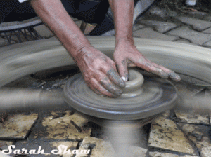 A potter begins to create a pot in Kerala