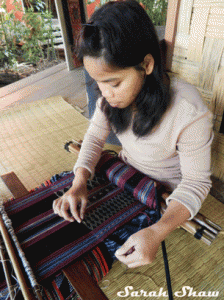 An experienced weaver for Ock Pop Tok