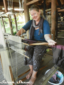 Learning to weave at a loom in Laos