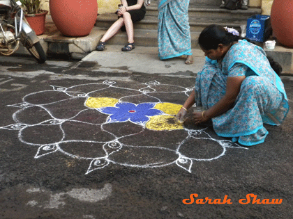 Photo three in the series of how to create Kolam