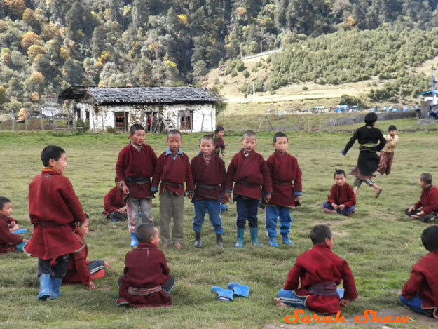 Brokpa boys in their red wool coats in Sakten, Bhutan