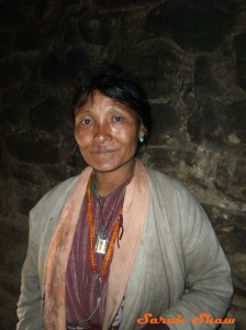 A woman from eastern Bhutan wears her mala beads