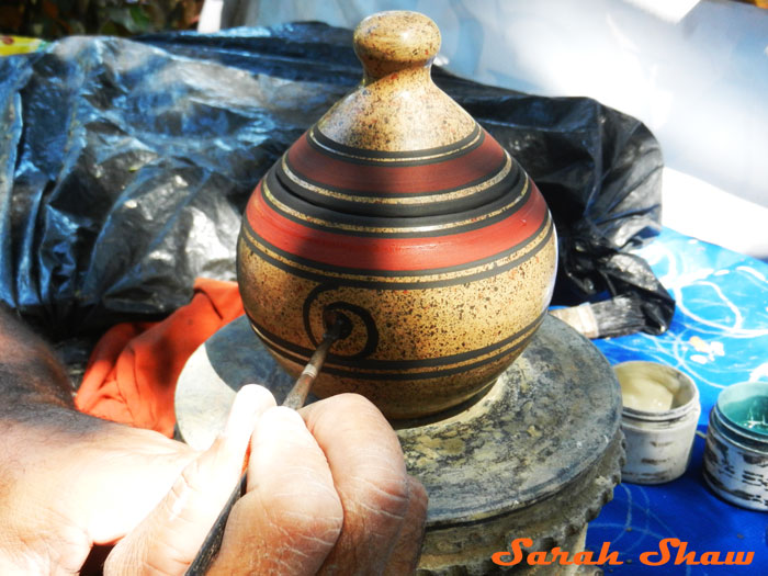 Painting traditional designs in Guatil, Costa Rica