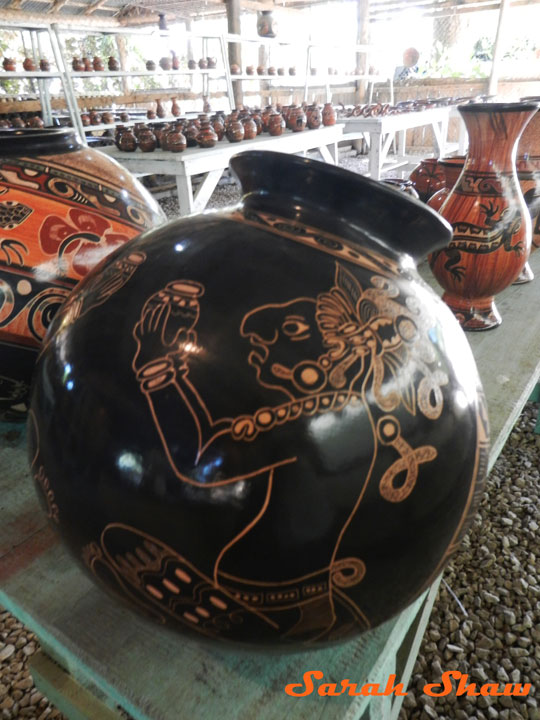 Chorotegan cheif offers a pot of choclate on a bowl in Guatil, Costa Rica