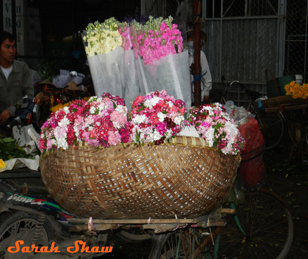 Bundles of dianthus and stocks at the Hanoi Flower Market, Viertnam