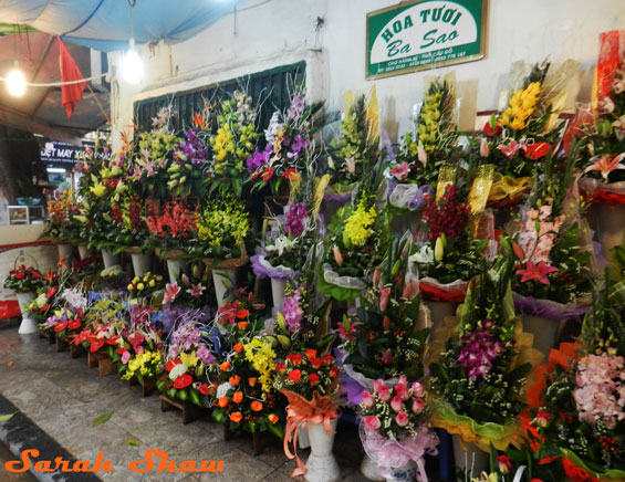 Floral arrangments on the sidewalk outside a florist shop in Hanoi, Vietnam