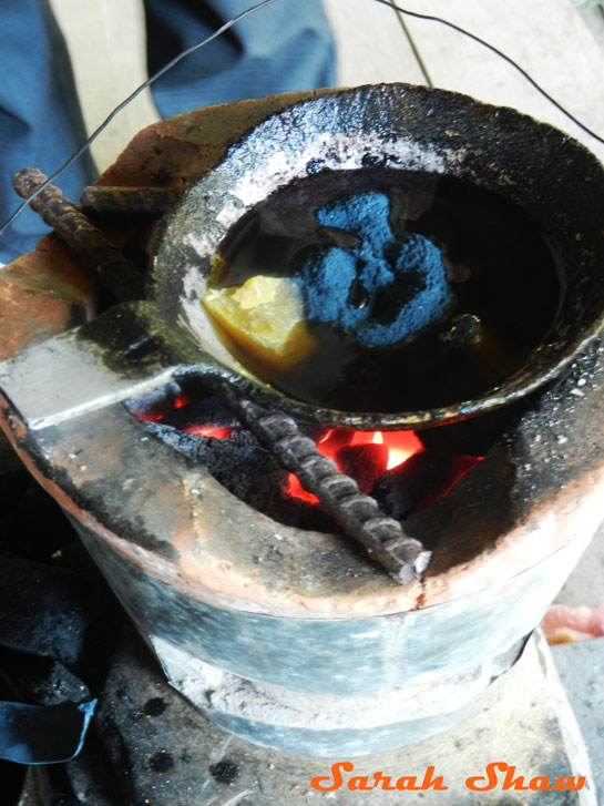 Indigo dye with beeswax for Hmong batik in Laos